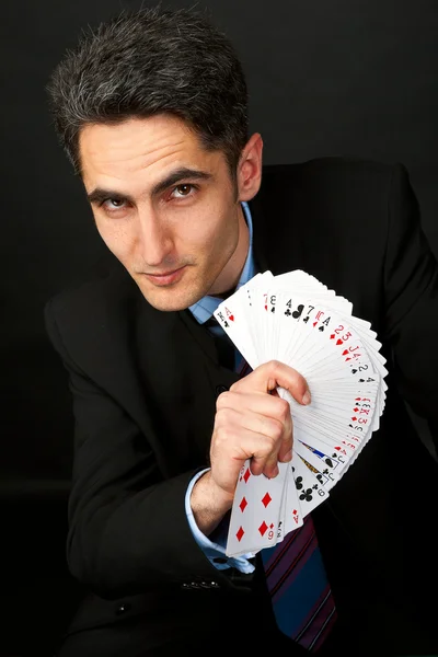 Jovem jogador sortudo com cartas — Fotografia de Stock