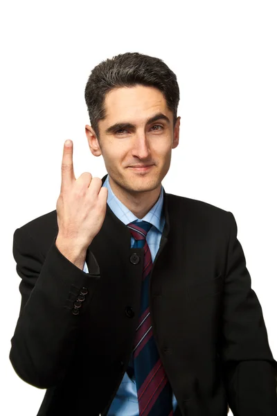 Young businessman is showing hand signs. — Stock Photo, Image
