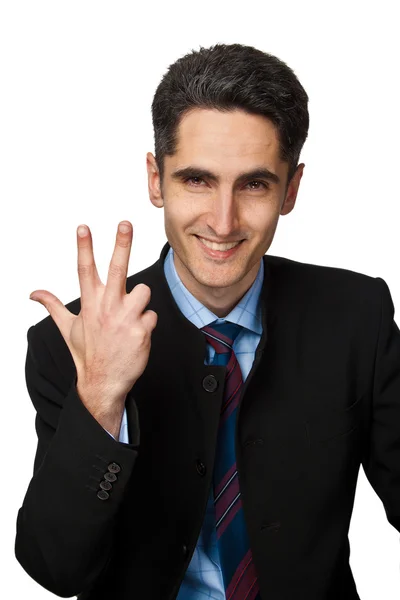 Young businessman is showing hand signs. — Stock Photo, Image