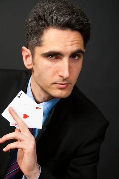 stock image Young lucky gambler with cards