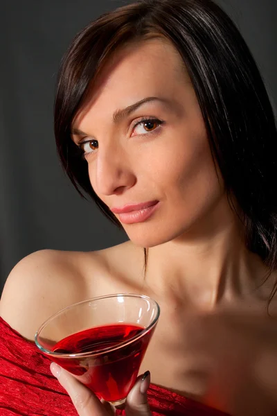 Young woman with wine in glass — Stock Photo, Image