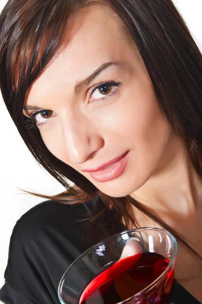 Jonge vrouw met wijn in glas. Stockafbeelding