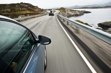 Car driving the Norwegian Atlantic road clipart