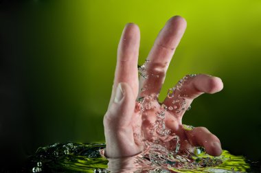 Human hand entering another dimension, dynamic water splash phot clipart