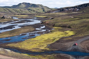 Little red off road car in Iceland clipart