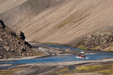 Crossing the river with off road car clipart