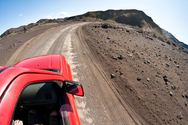 Driving on the deserted dirt road — Stock Photo, Image