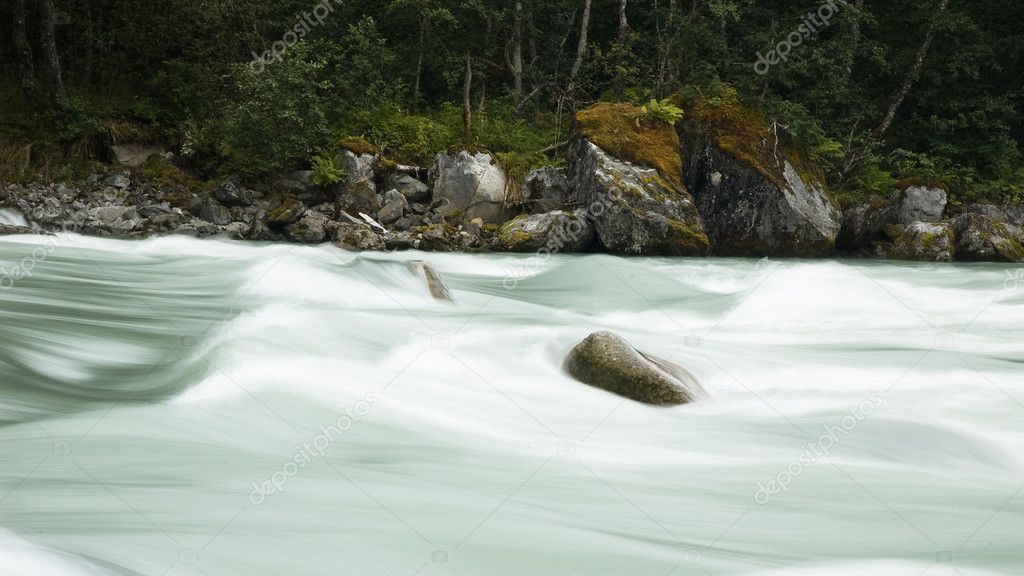 Glacier river with stones, long exposure