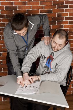 Police officer remove fingerprints from a suspect clipart