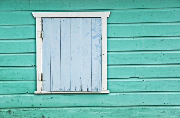 Gealterte farbige Holzwand mit Tür Stockbild