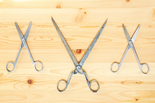 Three pairs of scissors in the form XXX — Stock Photo, Image