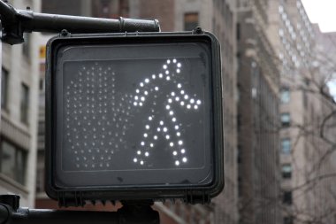 Pedestrian crosswalk sign in New York City clipart