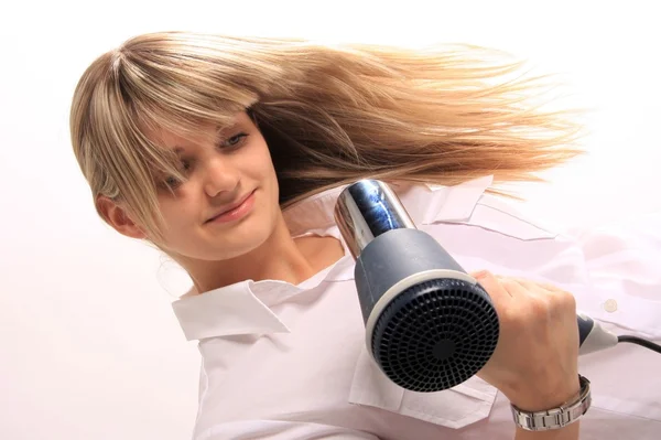 Young girl with hair dryer — Stock Photo, Image