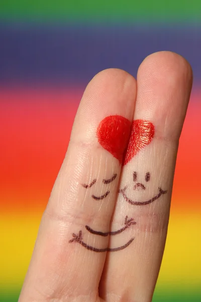 A happy couple in love with painted smiley — Stock Photo, Image