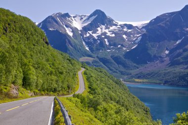 Scenic road by fjord clipart