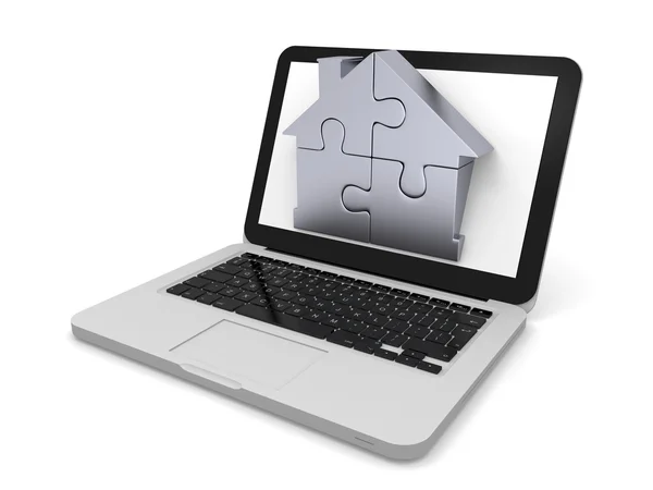 Huis puzzel op laptop scherm — Stockfoto