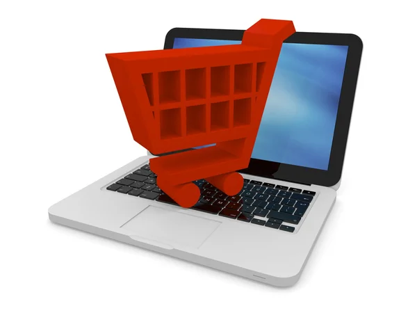 Red shopping trolley on laptop — Stock Photo, Image