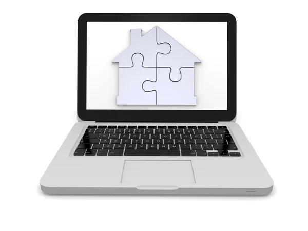 Home jigsaw on laptop screen — Stock Photo, Image