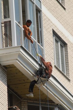 Migrant workers on construction sites in Moscow clipart