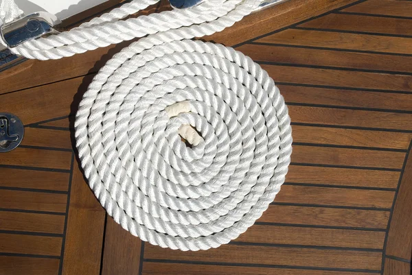 Coiled line of boat rope on deck