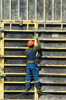 Migrant workers on construction sites in Moscow clipart