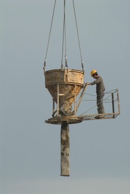 Migrant workers on construction sites in Moscow clipart