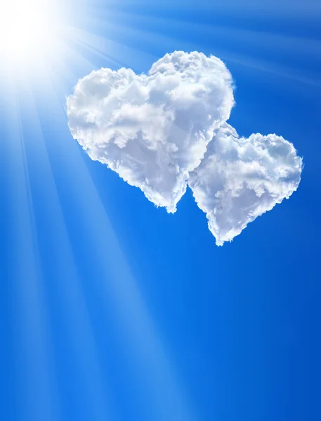Hearts in clouds against a blue clean sky — Stock Photo, Image