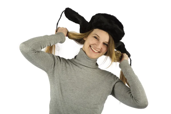 毛皮の帽子で笑っている女の子 ストックフォト