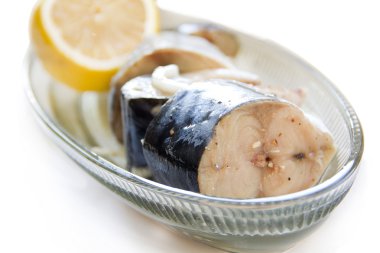 Salted mackerel with lemon clipart