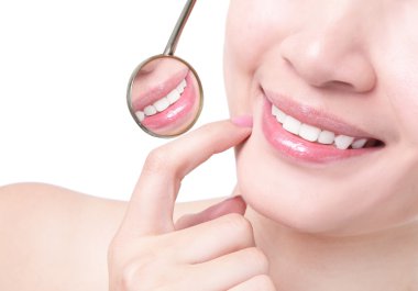 Healthy woman teeth and a dentist mouth mirror clipart