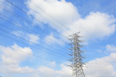 Electrical tower on a background of the blue sky clipart