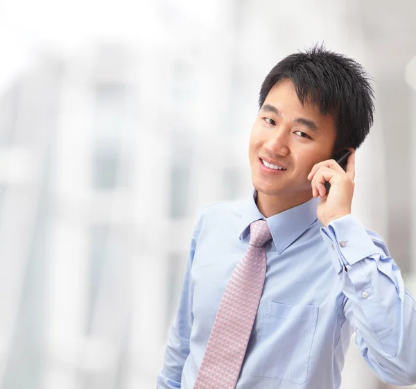 Handsome business man speaking mobile phone — Stock Photo, Image