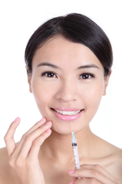 Woman smile recieving a injection in her lip — Stock Photo, Image