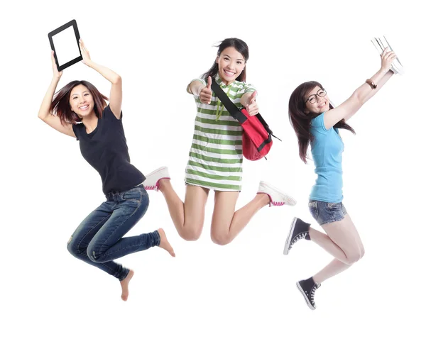 Excited group of girl students jumping — Stock Photo, Image