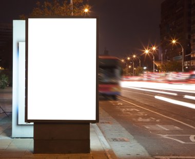 Blank billboard at night in the city Street clipart