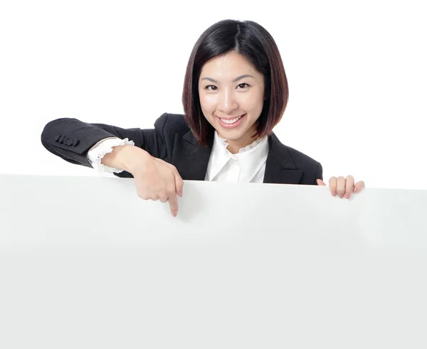 Mujer de negocios feliz mostrando cartelera en blanco —  Fotos de Stock