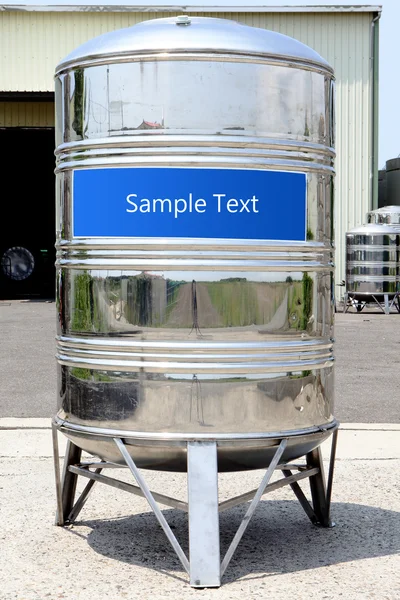 Steel water tower tank with sample text — Stock Photo, Image