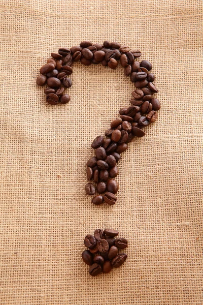 Coffee beans on linen background (question mark) — Stock Photo, Image