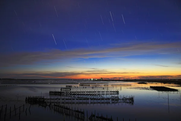 Beautiful sunset and star trail — Stock Photo, Image