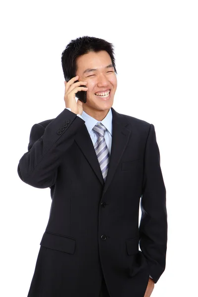 Młody biznes człowiek szczęśliwy, mówiąc telefon komórkowy — Zdjęcie stockowe