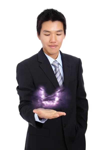 Young business man holding thunder and lightning — Stock Photo, Image