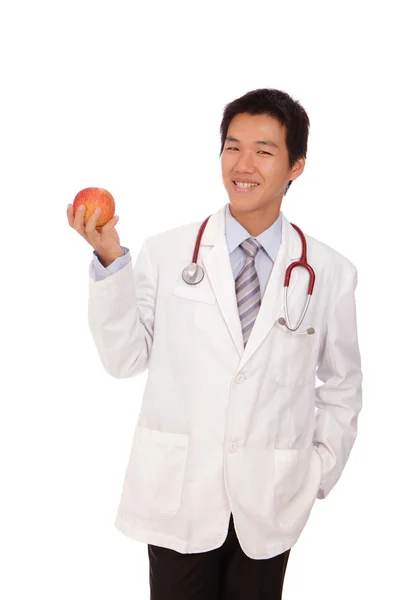Jonge dokter houden een appel — Stockfoto