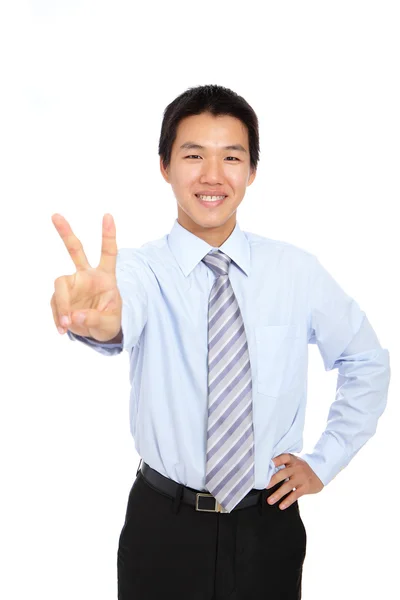 Joven hombre de negocios mostrando la señal de victoria — Foto de Stock