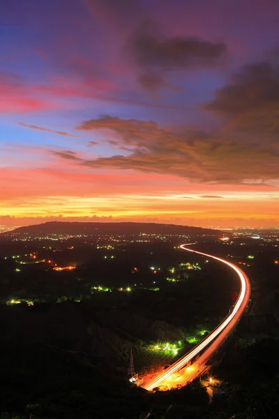 Highway in the night with amazing sunset — Stock Photo, Image