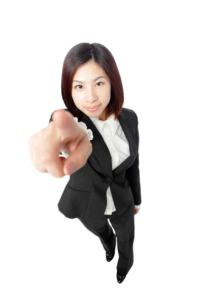 Femme d'affaires attirante pointant son doigt — Photo