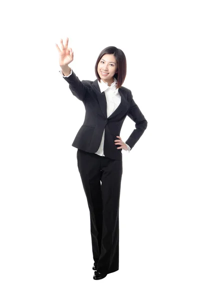 Perfect business woman showing OK hand sign in full length — Stock Photo, Image