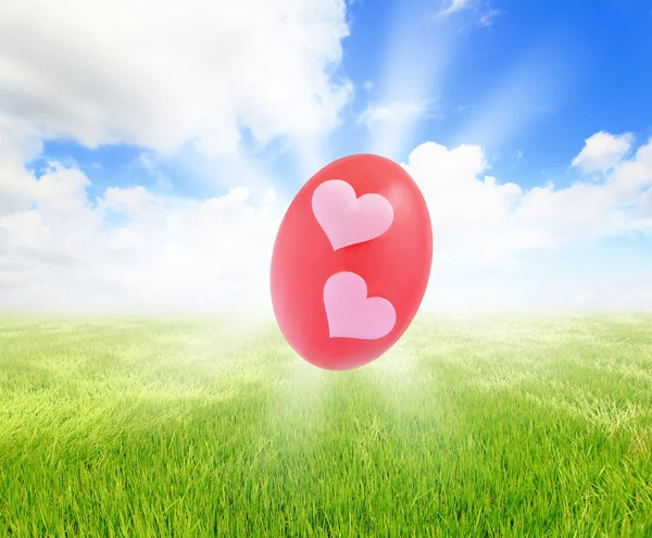 Easter eggs on grass with blue sky — Stock Photo, Image
