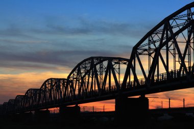 Aged and old railroad bridge silhouette clipart