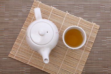 Healthful green tea and teapot clipart