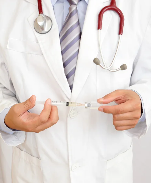 A doctor holding injector — Stock Photo, Image